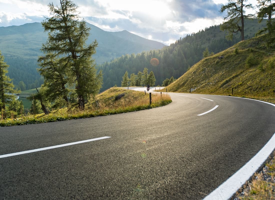 Asphalt road in Austria, Alps in a beautiful summer day, Hochalpenstrasse.
